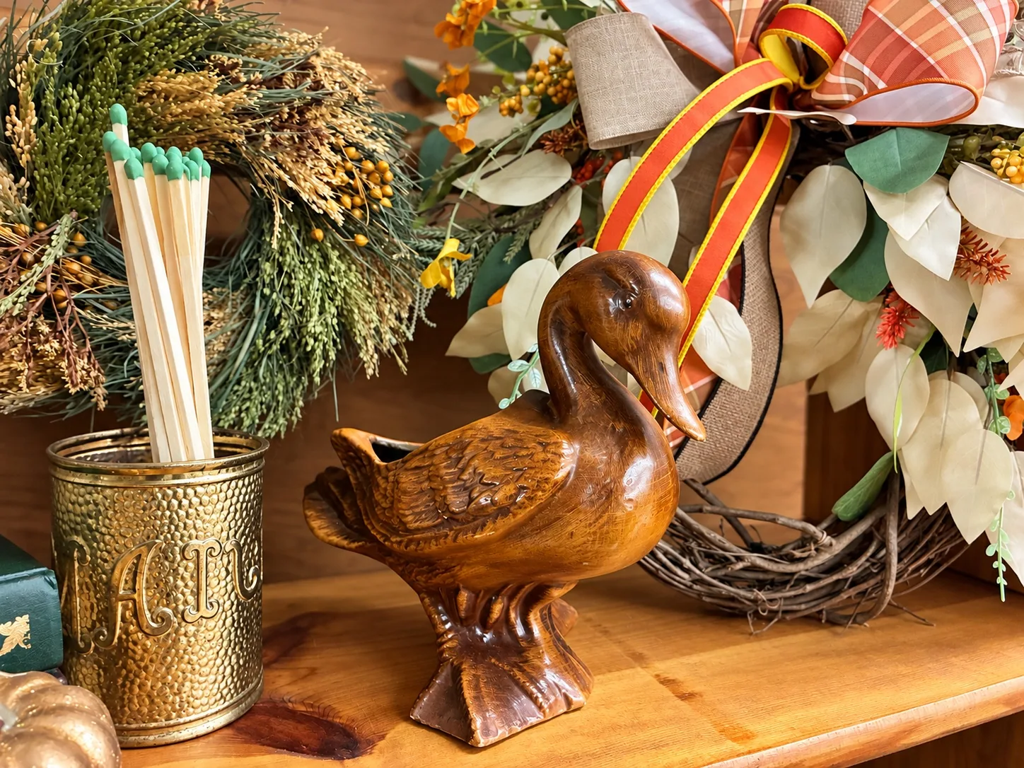 Carved duck and vintage accessories